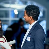 International Anchor Allies Winter 2026 First Mixer- 2 in a hearty conversation over a bingo game